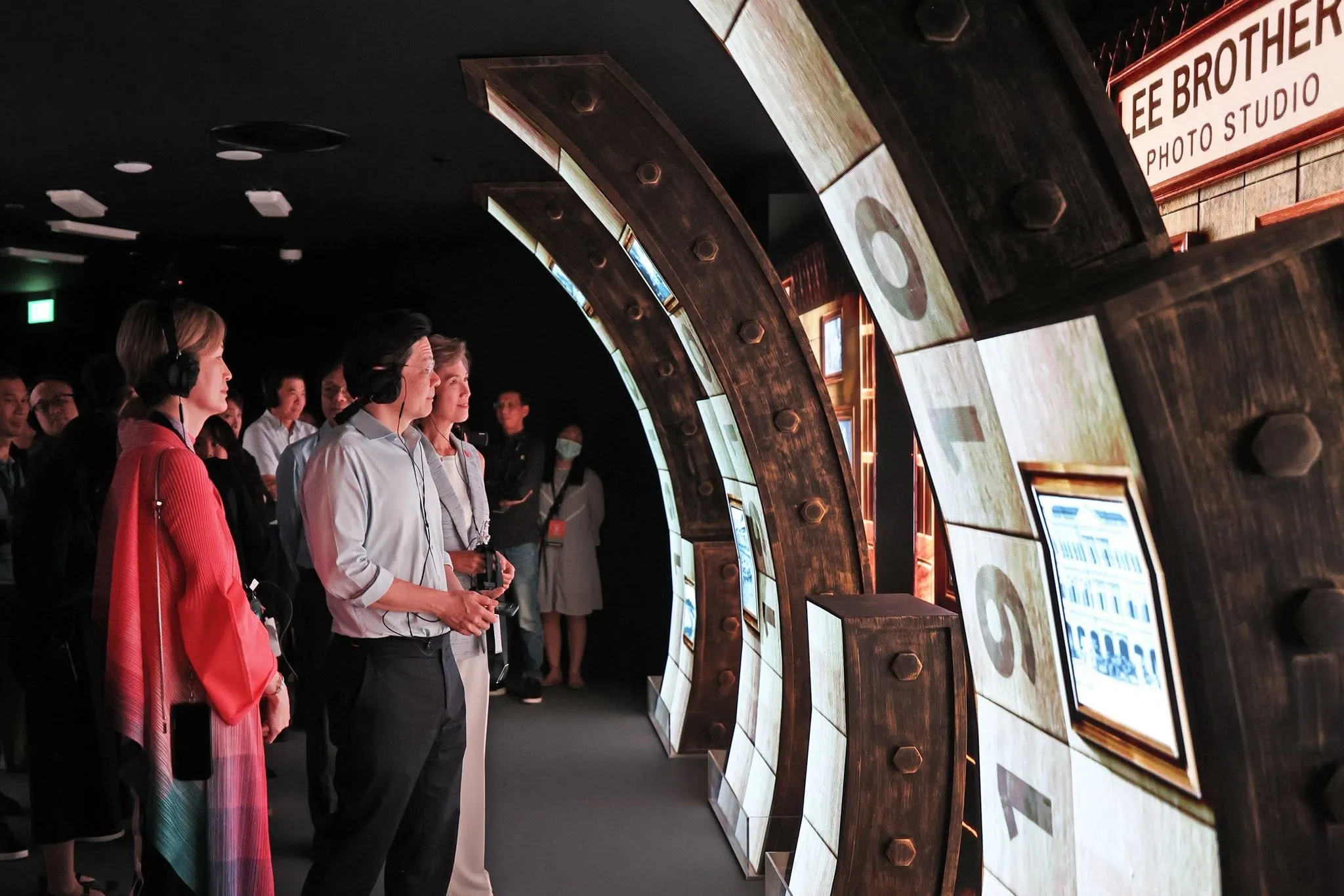 Wheels of Time, visitors reading the curved year wall