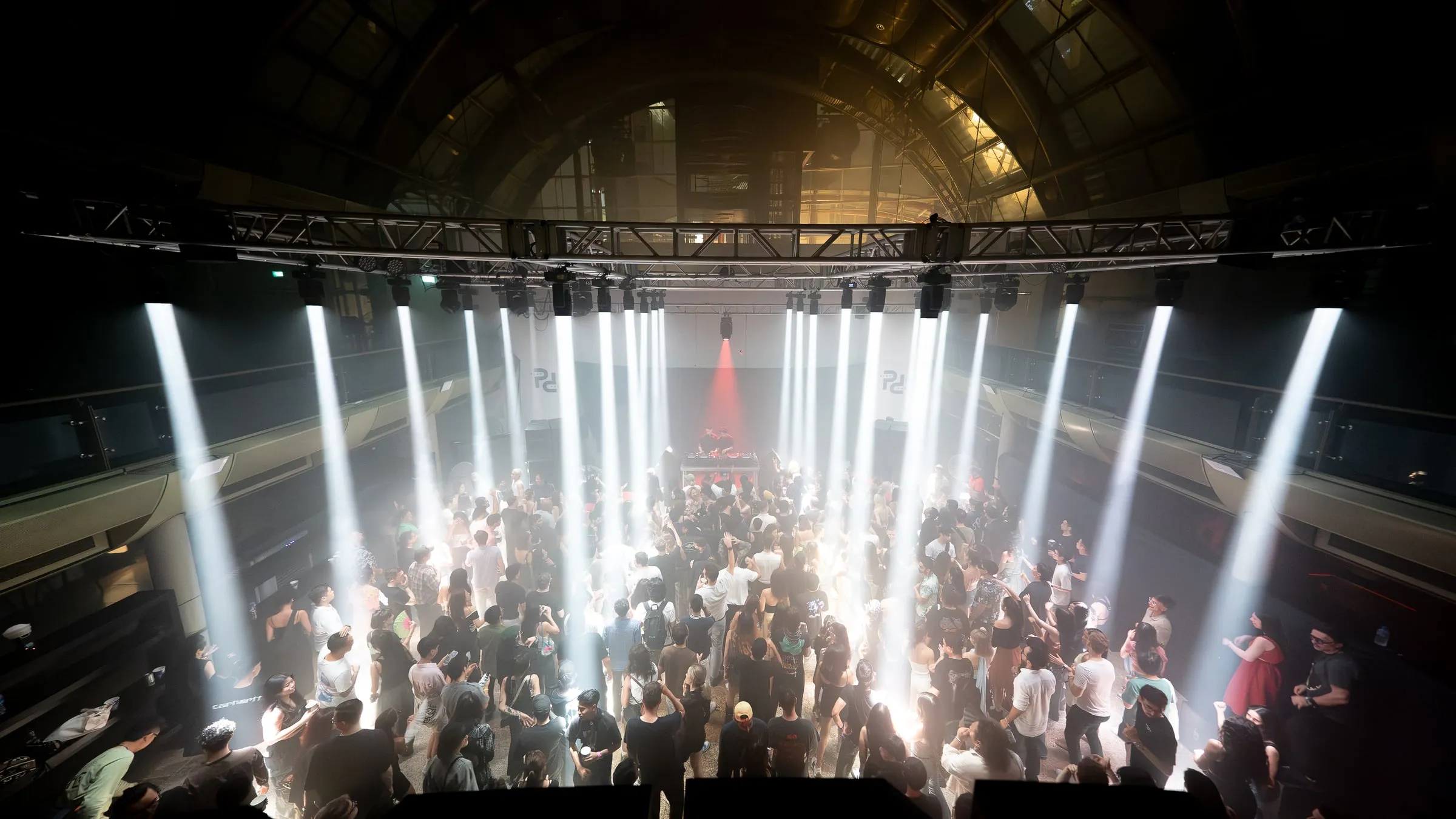 White beams through haze over a full floor