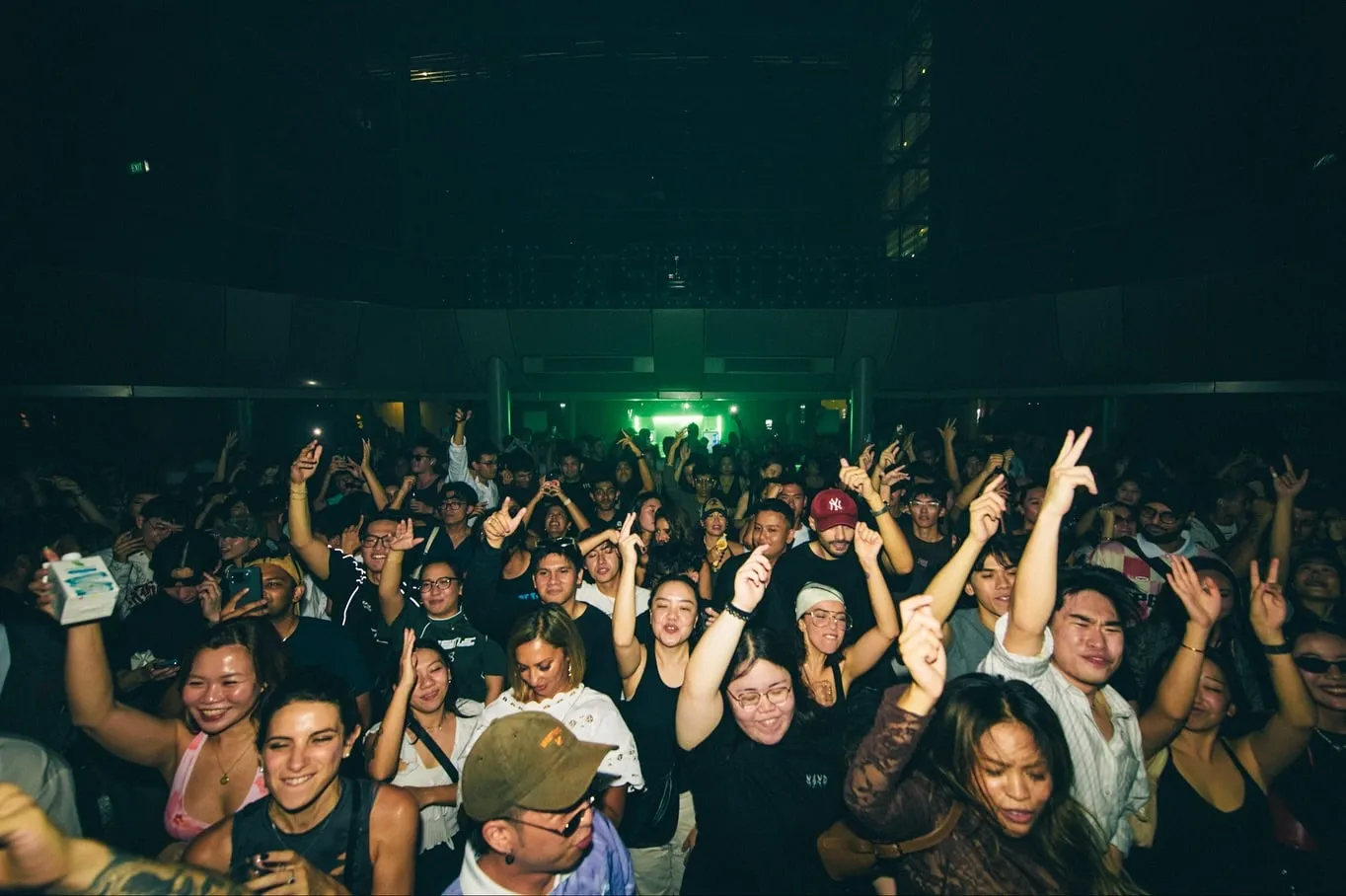 The floor, front rows, lit green