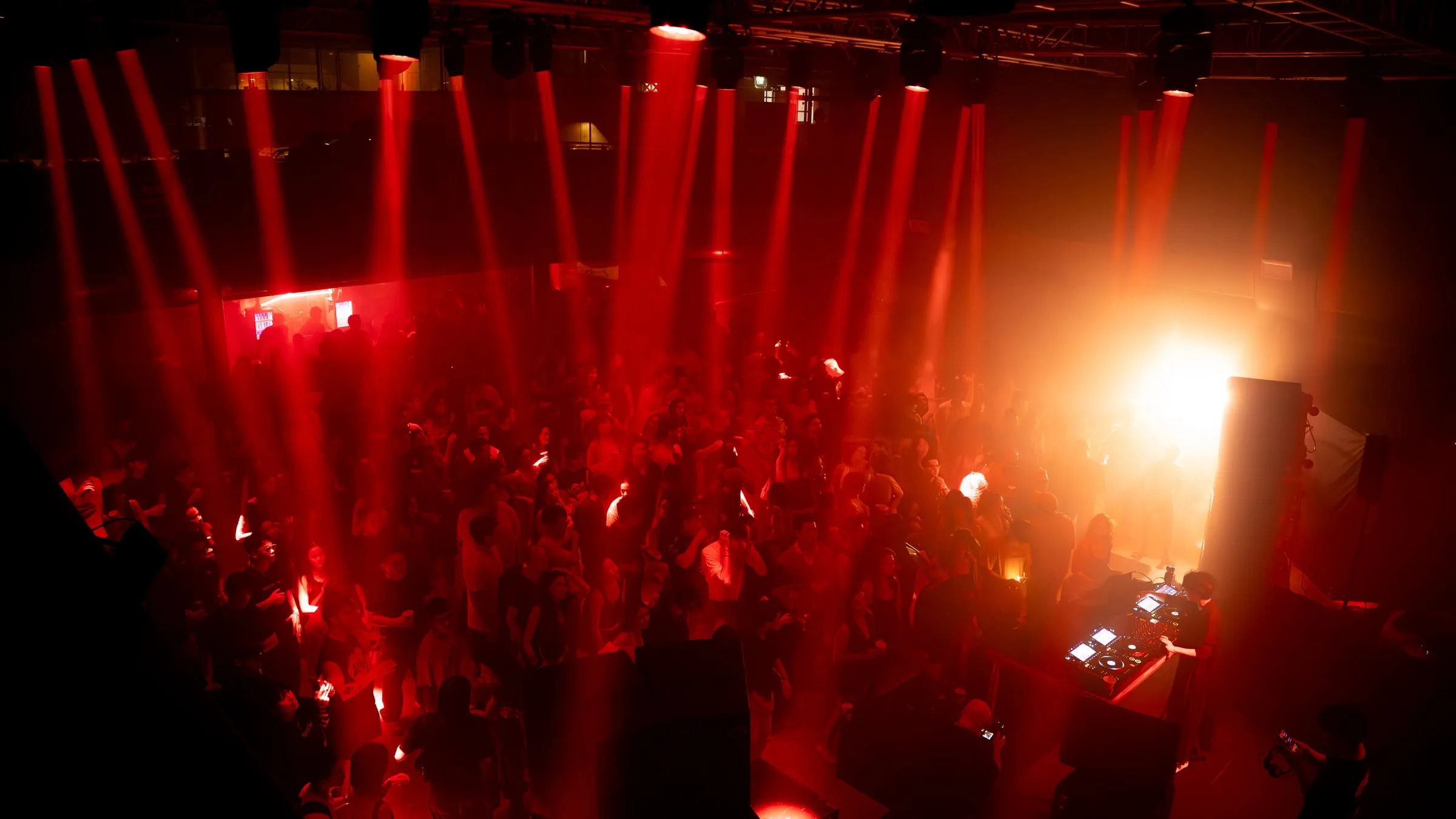The floor under red light, hands up